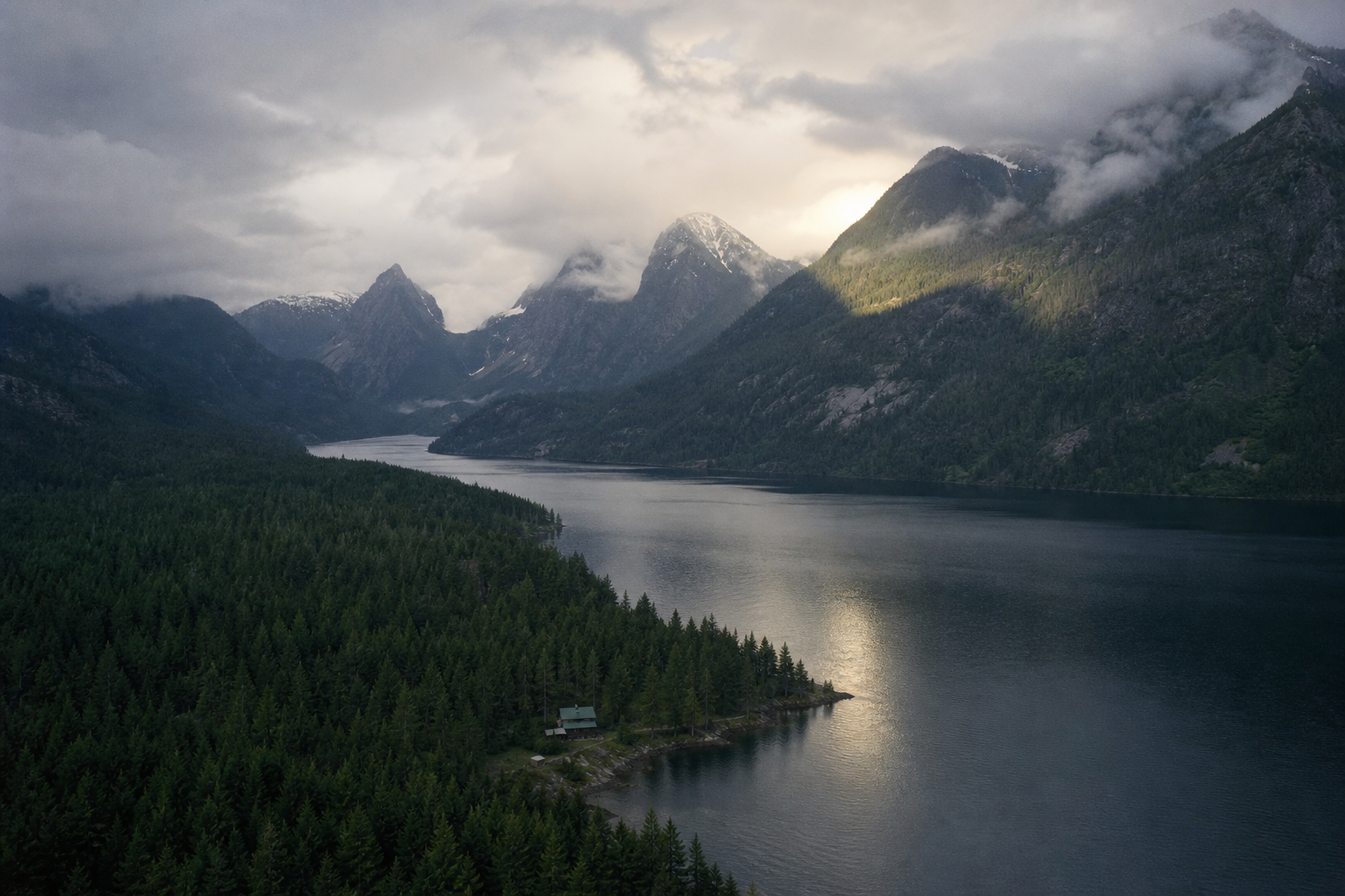 A remote research cabin beside a mountain lake in the Pacific Northwest